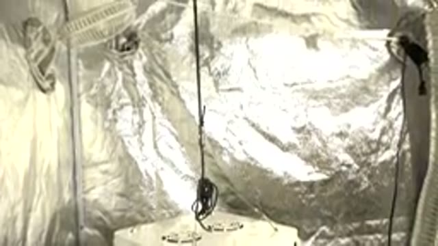 WESTMINSTER COLORADO-2015: Image Of An Object Being Suspended By A Wire In A Cabin
