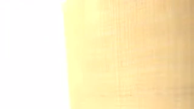 WESTMINSTER COLORADO-2015: Close Up Rotating Yellow Object Under A White Light
