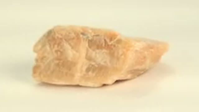 WESTMINSTER COLORADO-2015: Close Up Rotating Yellow Sandstone Quartz Rock Under
