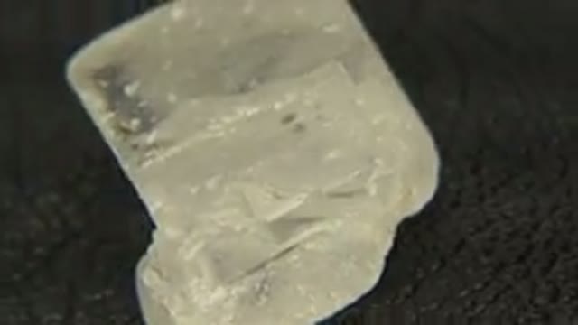WESTMINSTER COLORADO-2015: A Close-Up Rotating Specimen of Murky Quartz Pitted