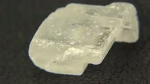 WESTMINSTER COLORADO-2015: Close Up Rotating White Quartz Crystal Rock On Black