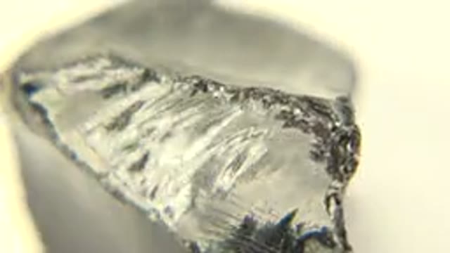 WESTMINSTER COLORADO-2015: Rotating Rock on White Floor Under Black Glass