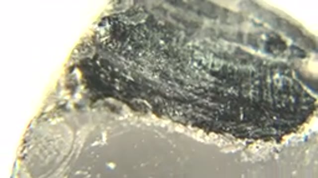WESTMINSTER COLORADO-2015: Shiny Mineral Rock Spinning On White Background With