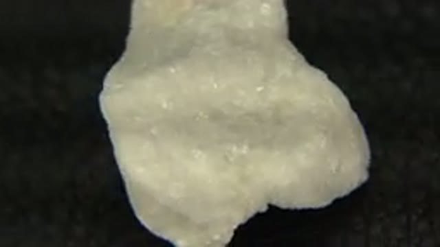 WESTMINSTER COLORADO-2015: Close Up Rotating White Crystal Rock On Black Felt