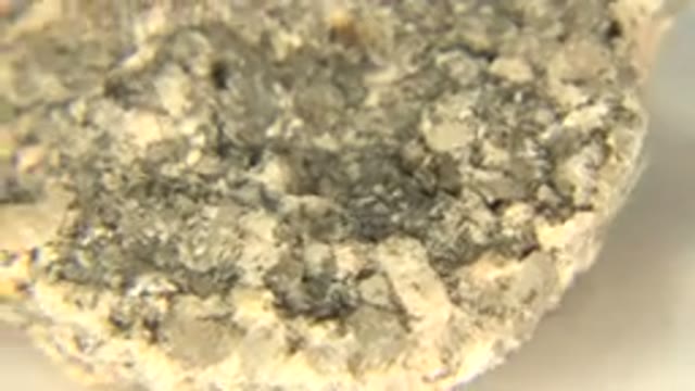 WESTMINSTER COLORADO-2015: Rotating Rock on White Floor with Yellow Sand
