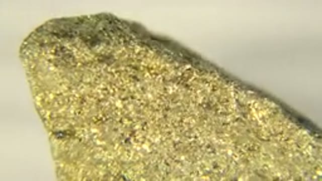 WESTMINSTER COLORADO-2015: Close Up Rotating Gold Nugget Under A White Light