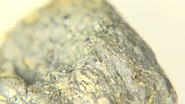 WESTMINSTER COLORADO-2015: Close Up Rotating Black And Yellow Rock Under White