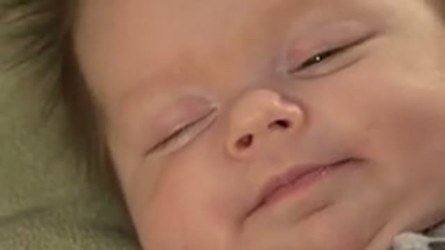 WESTMINSTER COLORADO-2015: Sleeping Baby Wearing Black and White Shirt Opens Eyes