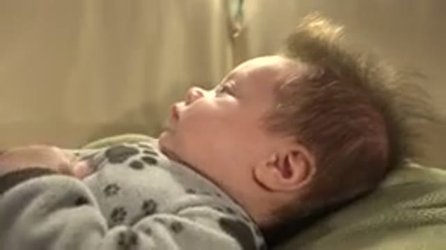 WESTMINSTER COLORADO-2015: Child Laughing Joyfully in Bed