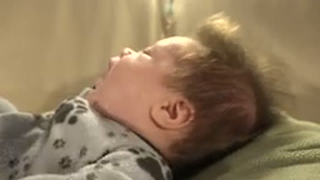 WESTMINSTER COLORADO-2015: A Baby With Blond And Spiky Hair Is Lying Down And Moving Hands