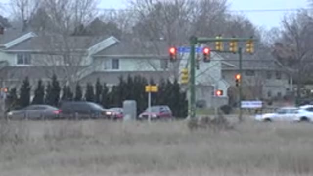 WESTMINSTER COLORADO-2015: It's Snowing And There Are Some Cars Stopped At The Intersection