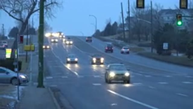 WESTMINSTER COLORADO-2015: Cars With Headlights On Drive Peacefully On Snowy And