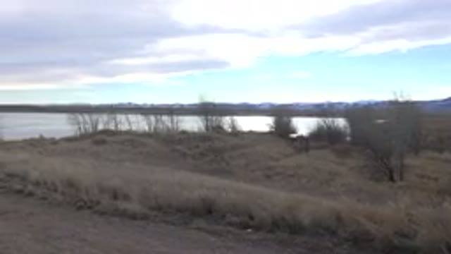 WESTMINSTER COLORADO-2015: Tan Beach Blue Sky And Grey Clouds On A Clear Day