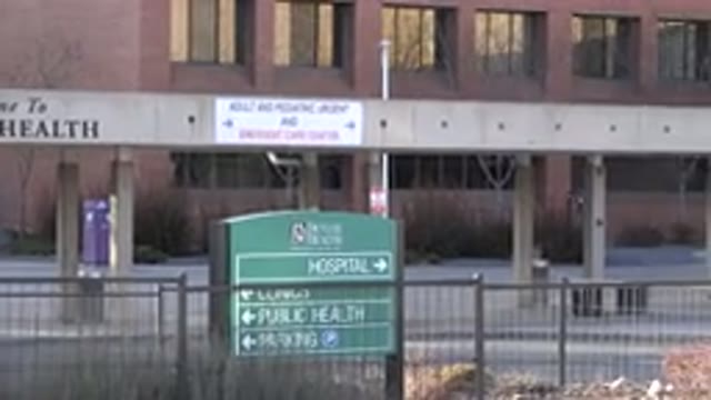 WESTMINSTER COLORADO-2015: A Building In A City With A Road Sign In The Foreground