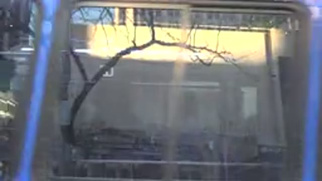 WESTMINSTER COLORADO-2015: Bus Passing In The Street With Person Traveling City