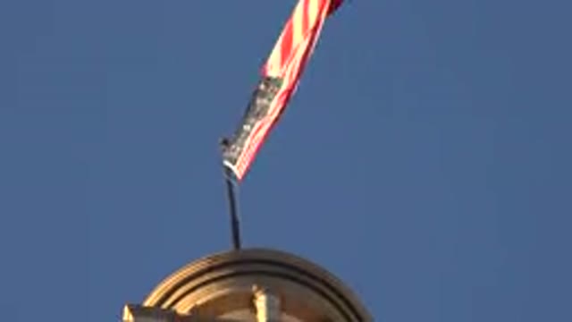 WESTMINSTER COLORADO-2015: Billowing American Flag and Windsock on a Sunny Day