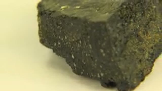 WESTMINSTER COLORADO-2015: Rotating Black And Yellow Rock On A White Surface