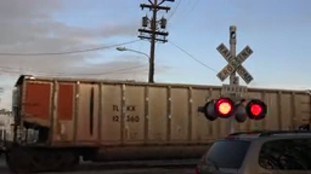 WESTMINSTER COLORADO-2015: A Car Stopped At The Crossroads As The Train Passes