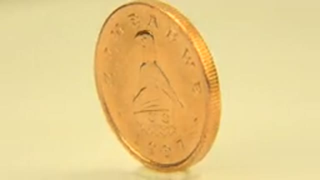 WESTMINSTER COLORADO-2015: Coin On A Table Spinning Like A Top