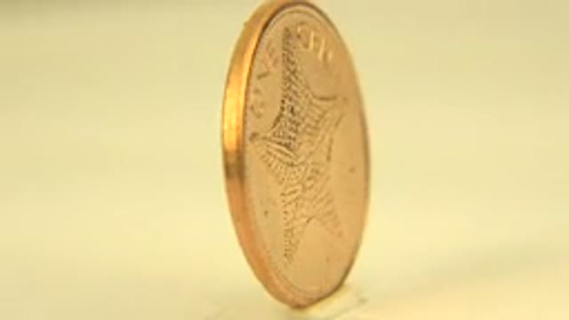 WESTMINSTER COLORADO-2015: One Cent Bahamas Coin Under A White Light