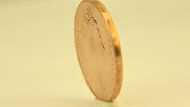 WESTMINSTER COLORADO-2015: Close Up Rotating Bermuda Penny Under White Light