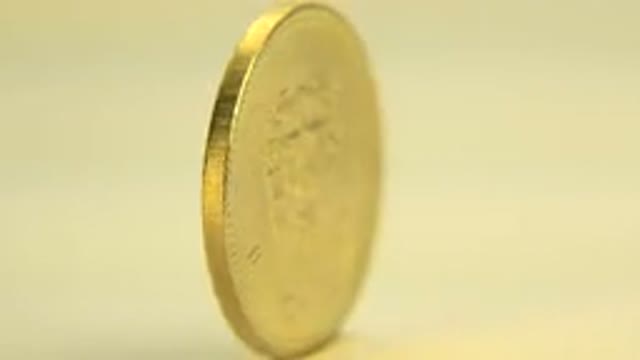 WESTMINSTER COLORADO-2015: Gold Coin Spinning On A Revolving Table