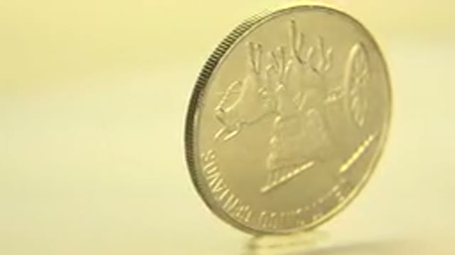 WESTMINSTER COLORADO-2015: Silver Coin On A Revolving Table Spinning Around