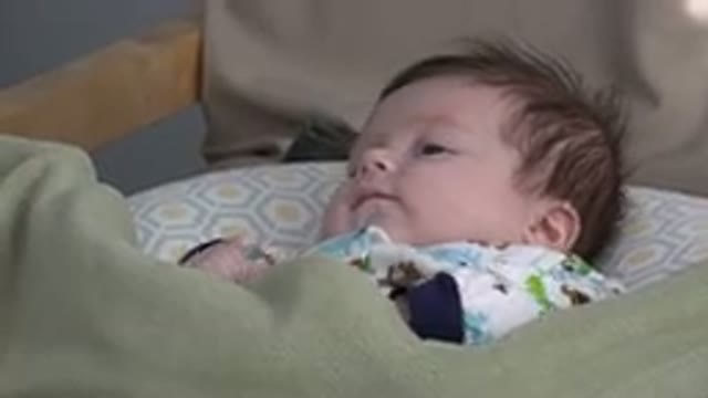 WESTMINSTER COLORADO-2015: A Baby in a Crib Laying on His Back Gazing Up