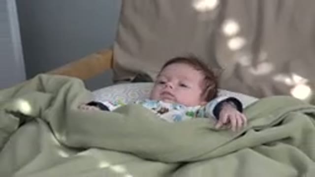 WESTMINSTER COLORADO-2015: A Baby With Covers In A Crib Stretching His Arms For