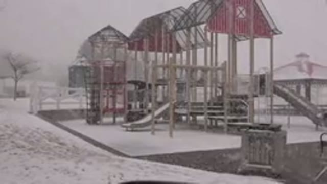 WESTMINSTER COLORADO-2015: Empty Red And Tan Wooden Playground During Snowstorm
