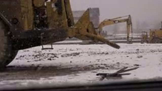 WESTMINSTER COLORADO-2015: A Snowy Construction Site With Vehicles Laying Around