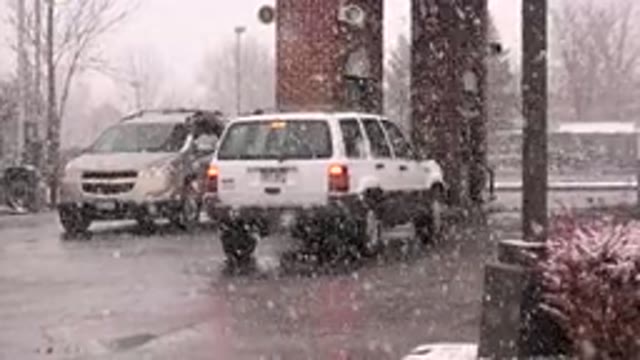 WESTMINSTER COLORADO-2015: Cars Leaving On A Cold Afternoon With Snow