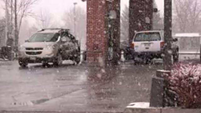 WESTMINSTER COLORADO-2015: Cars At A Gas Station During Snowy Weather
