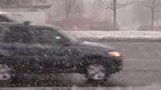WESTMINSTER COLORADO-2015: Moderate Traffic On Street During Snow Storm On A