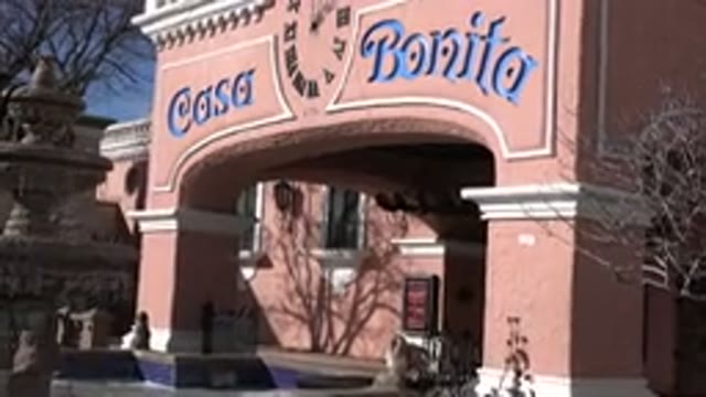 DENVER COLORADO-2015: Camera Slowly Zooms In Towards A Stucco Facade With A Sign