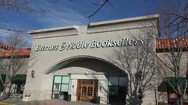 DENVER COLORADO-2015: The Front Of A Bookstore With Two Garbage Cans On The Sidewalk