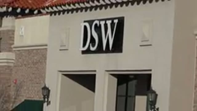 DENVER COLORADO-2015: Focus On Storefront Sign Reads Down When Camera Zooms Out