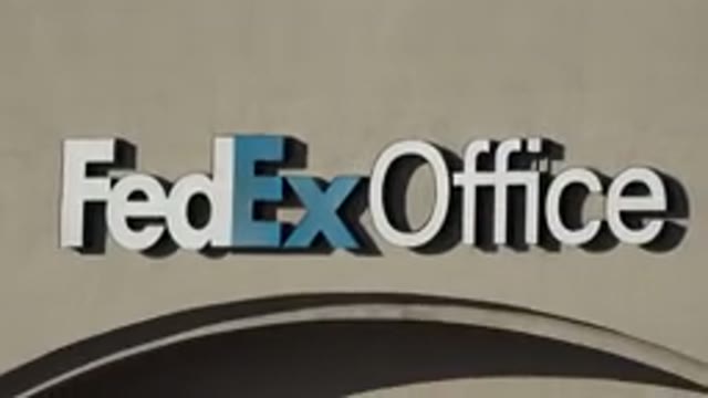 DENVER COLORADO-2015: Focus On Store Signage That Reads FedEx Office On Building