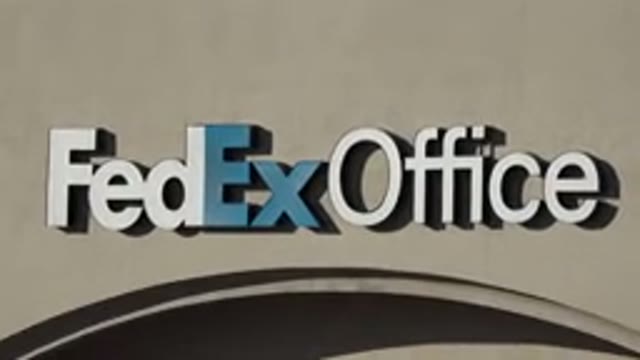 DENVER COLORADO-2015: Front Of A FedEx Office Building With A Black Door And Large Windows