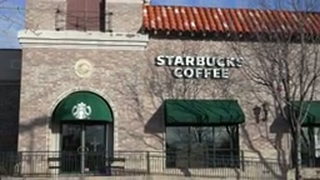 DENVER COLORADO-2015: White Lettered Starbucks Coffee Sign On A Sunny Day
