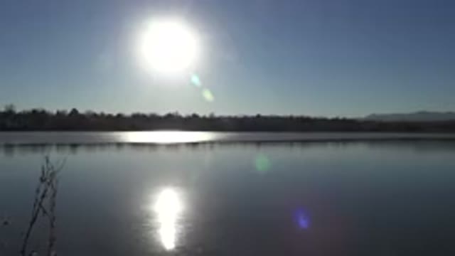 WESTMINSTER COLORADO-2015: The Early Morning Sun Shines Bright Off The Lake