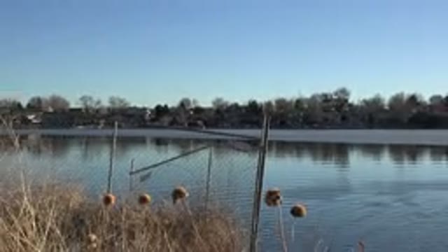 WESTMINSTER COLORADO-2015: A Recording Of A Lake With An Iron Fence On The Edge