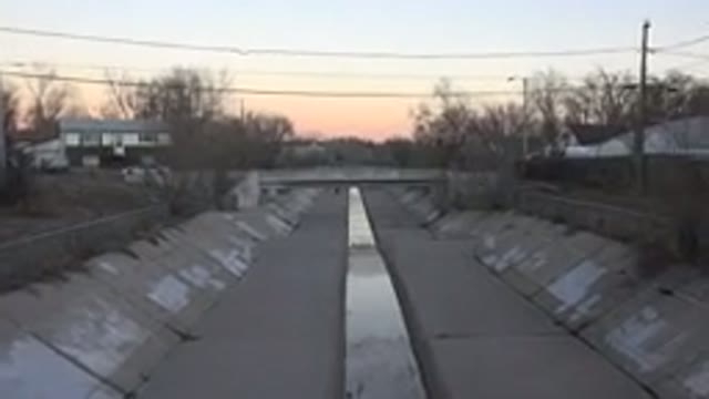 WESTMINSTER COLORADO-2015: A Man Running Down A City Sewer Channel During The
