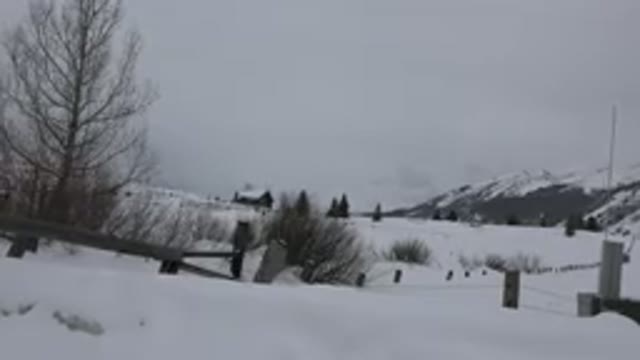 CRESTED BUTTE COLORADO-2015: House On A Snowy Hill Near A Frozen Mountain At Dusk