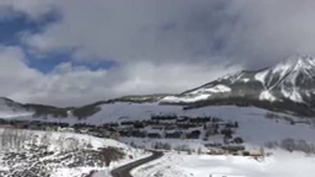 CRESTED BUTTE COLORADO-2015: A Snow-Covered Mountain With Rocky Terrain