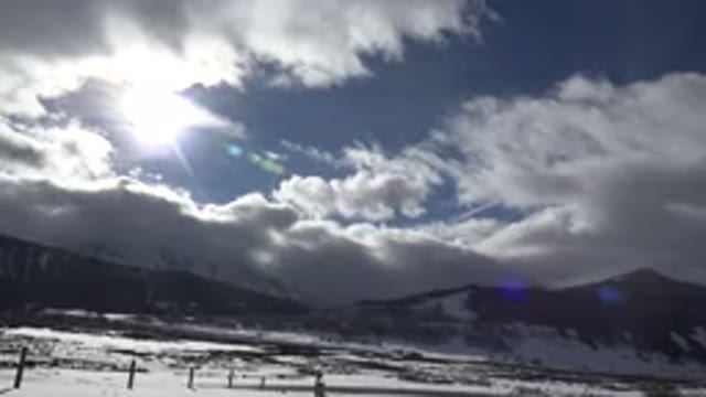 CRESTED BUTTE COLORADO-2015: Snow Covered Mountains And Hillside With Sun And