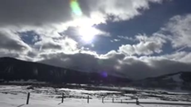 CRESTED BUTTE COLORADO-2015: Landscape With Mountains And Sky And Cloud And Sun