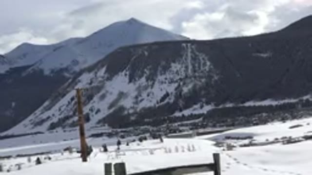 CRESTED BUTTE COLORADO-2015: Panorama Of A Snowy Mountain With A Road In The
