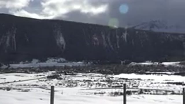 CRESTED BUTTE COLORADO-2015: Land Below A Mountain Covered In Snow And Sun