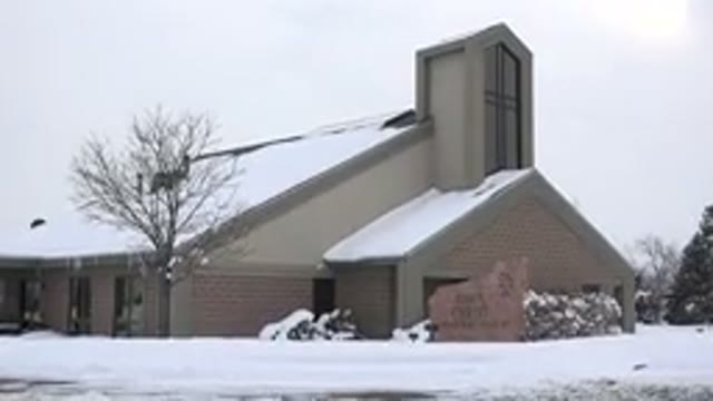 ARVADA COLORADO-2015: Tan Snow Covered Church On A Cloudy Day